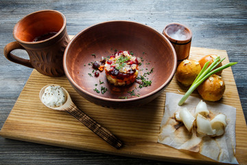 wooden table topped with plates of traditional ukrainian food
