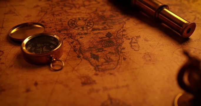 navigation items on old world map. 4k dolly shot