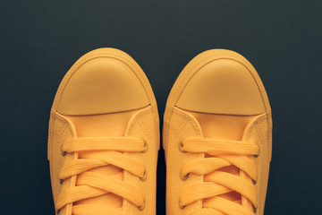 Stylish yellow sneakers from above