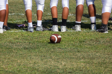 Football placed on field &ndash; Players getting ready for the game 