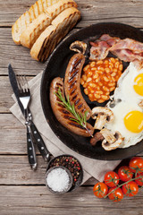English breakfast. Fried eggs, sausages, bacon