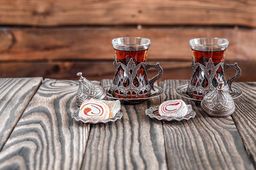 Fragrant Turkish tea and Turkish sweets in national dishes