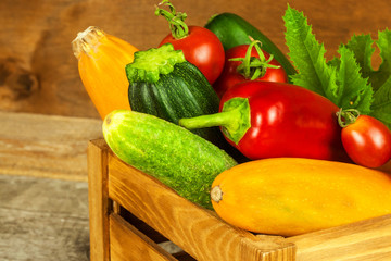 Fresh vegetables on an old wooden table. Harvest of vegetables. Healthy food. Raw food. Life on the farm.