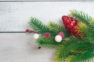 Fototapeta na wymiar Christmas fir branches with citrus slices, sparkling balls and pine cones. Flat lay space for text.