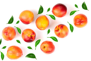 ripe nectarine with leaves isolated on white background with copy space for your text. Top view. Flat lay pattern