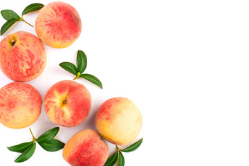 ripe peaches with leaves isolated on white background with copy space for your text. Top view. Flat lay pattern