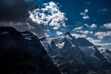 Dramatic sky in a valley with a mountain Grossglockner