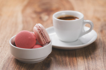 espresso with macarons on wood table