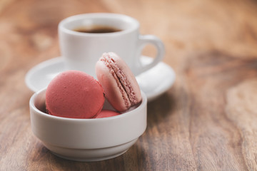 espresso with macarons on wood table