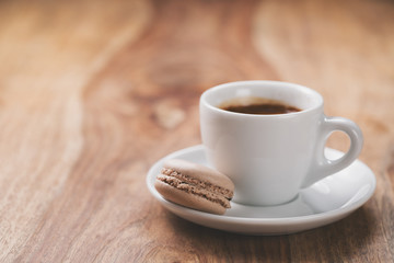 espresso with macaron on wood table