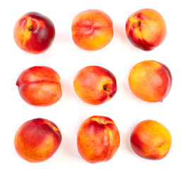 ripe nectarine with leaves isolated on white background. Top view. Flat lay pattern. Set or collection