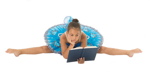Girl ballerina stretching split while read book. Ballet career issues. Depriving children...