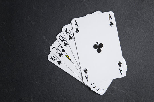 Poker cards on a dark background. Poker consisting of ace to tens of cards.