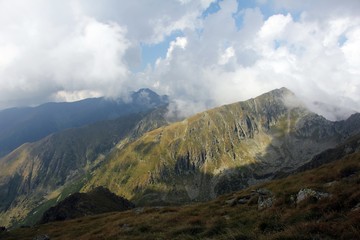 Layers of mountains surrounded by clouds