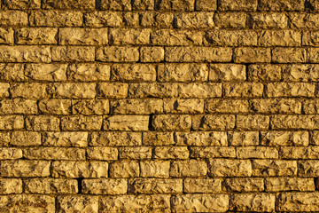 Ancient yellow brick wall background or texture.