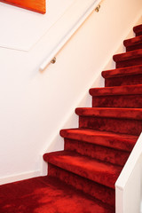 Modern Indoor Marble Staircase With Red Carpet.