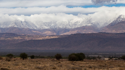 Atlas mountains covered in snow as seen from a highway in Morocco