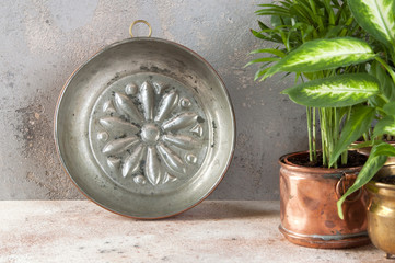 Vintage copper mold on a concrete background.