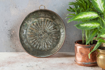 Vintage copper mold on a concrete background.