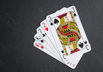 Poker cards on a dark background. Two cards with the same value.