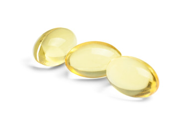 Cod liver oil pills on white background