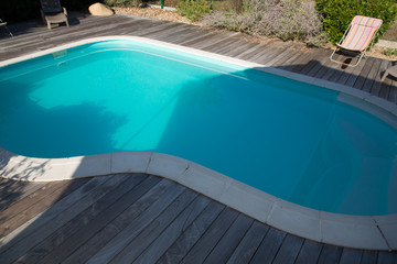 Obraz na płótnie Canvas swimming pool nobody inside in backyard of a residential home