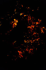 Flame of fire with sparks on a black background