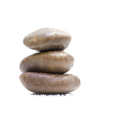Close-up of A Stack of Three Brown River Stones with Rain Drops, Isolated Against a White Background