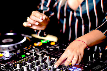 Young girl female shot party dj audio controlling mixing. Turntable High quality Sound mixing...