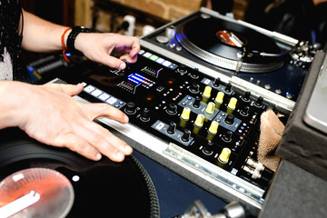 Close up shot vintage vinyl party dj audio equipment.Turntable High quality Sound mixing controller disc jockey in night club  . Pro audio equipment on stage in nightclub. Hifi sound system . 