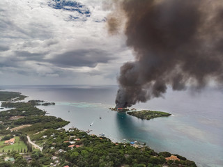 Fototapeta na wymiar Disaster Fire On Small Caribbean Resort Island
