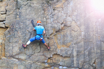Fototapeta premium secures the climber on a steep cliff insurance