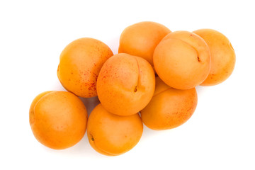 heap apricot fruits isolated on white background. Top view. Flat lay pattern