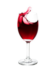 Red wine splash out of glass. Isolated on white background.