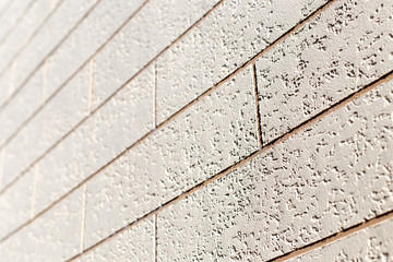 Rough wall texture, wall background, house facade with spatula technology. Close