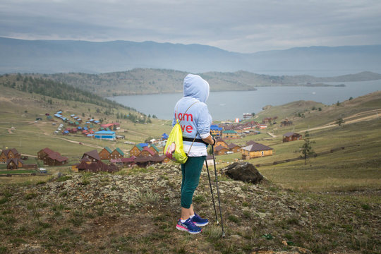 Woman looking at Small Sea strait of Lake Baikal. Siberia, Russia 
