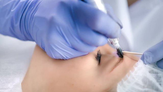 Microblading procedure or permanent make-up of eyebrows using eyebrow tattoo machine