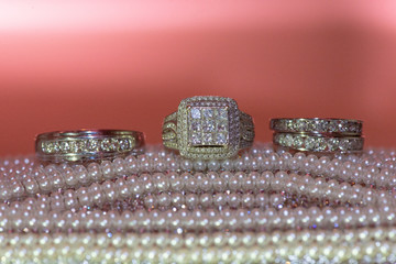 Three wedding rings on Pearls
