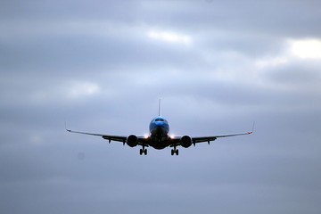 Face to an airplane on final approach 