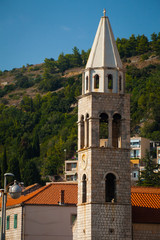 White stone bell tower at sunset