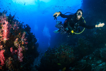 Fototapeta na wymiar SCUBA diver on an underwater tropical coral reef
