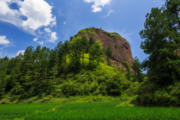 Wanfoshan Danxia Landform, Mount Wanfo. General Stone Scenic Area. Tongdao Dong Nationality Autonomous County, Hunan Province China. UNESCO World Heritage Location, Exotic Red Danxia, Green Grass