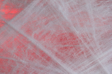 Halloween background concept. Full frame of cobweb on red backdrop.