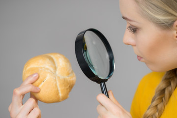 Bun bread roll and magnifying glass