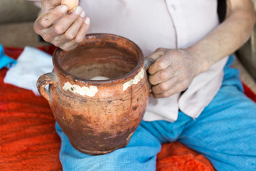 in the man's hand fresh eggs in the countryside