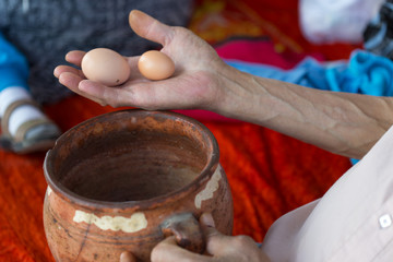 in the man's hand fresh eggs in the countryside