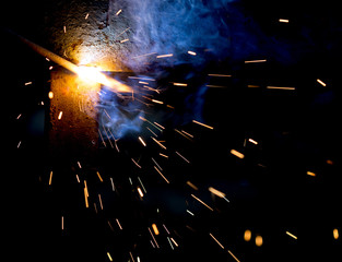 Flash and sparks from electric welding