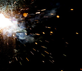 Flash and sparks from electric welding