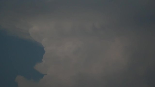 (Live action)　An aircraft passes in front of gigantic cumulonimbus around 6:50PM on August 26, 2018 in Tokyo, Japan