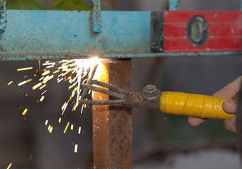 The electric welding process.Arc welding process